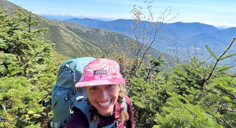 Zara taking a selfie on a mountain
