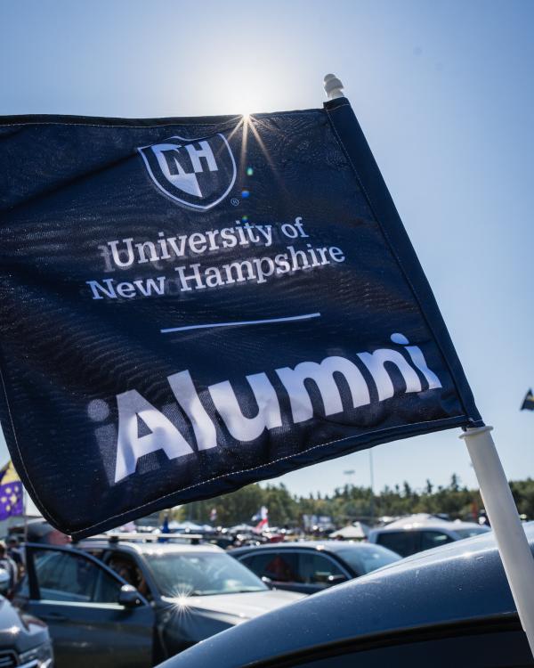 Flag that reads University of New Hampshire Alumni