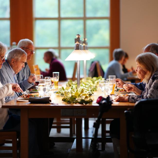 UNH alumni eating together during their reunion celebration