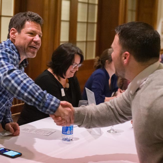 Alumni Shaking Hands
